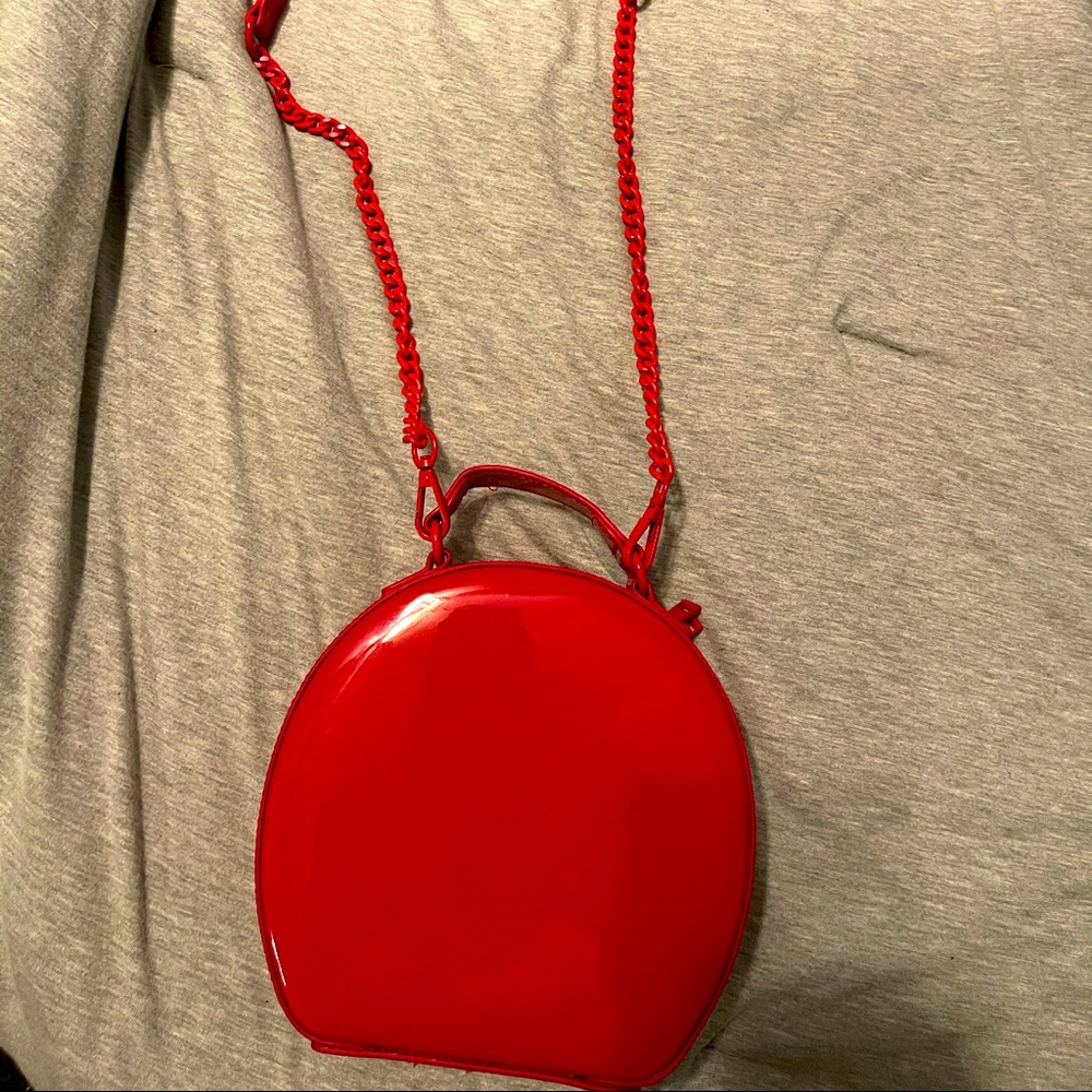Cherry red patent Call It Spring shoulder bag.